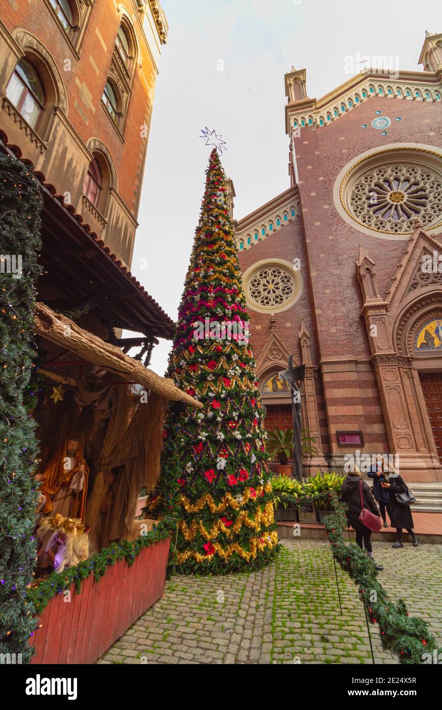 Christmas Tree and Decorations of Birth of Jesus in the yard of St Antuan Church Stock Photo
