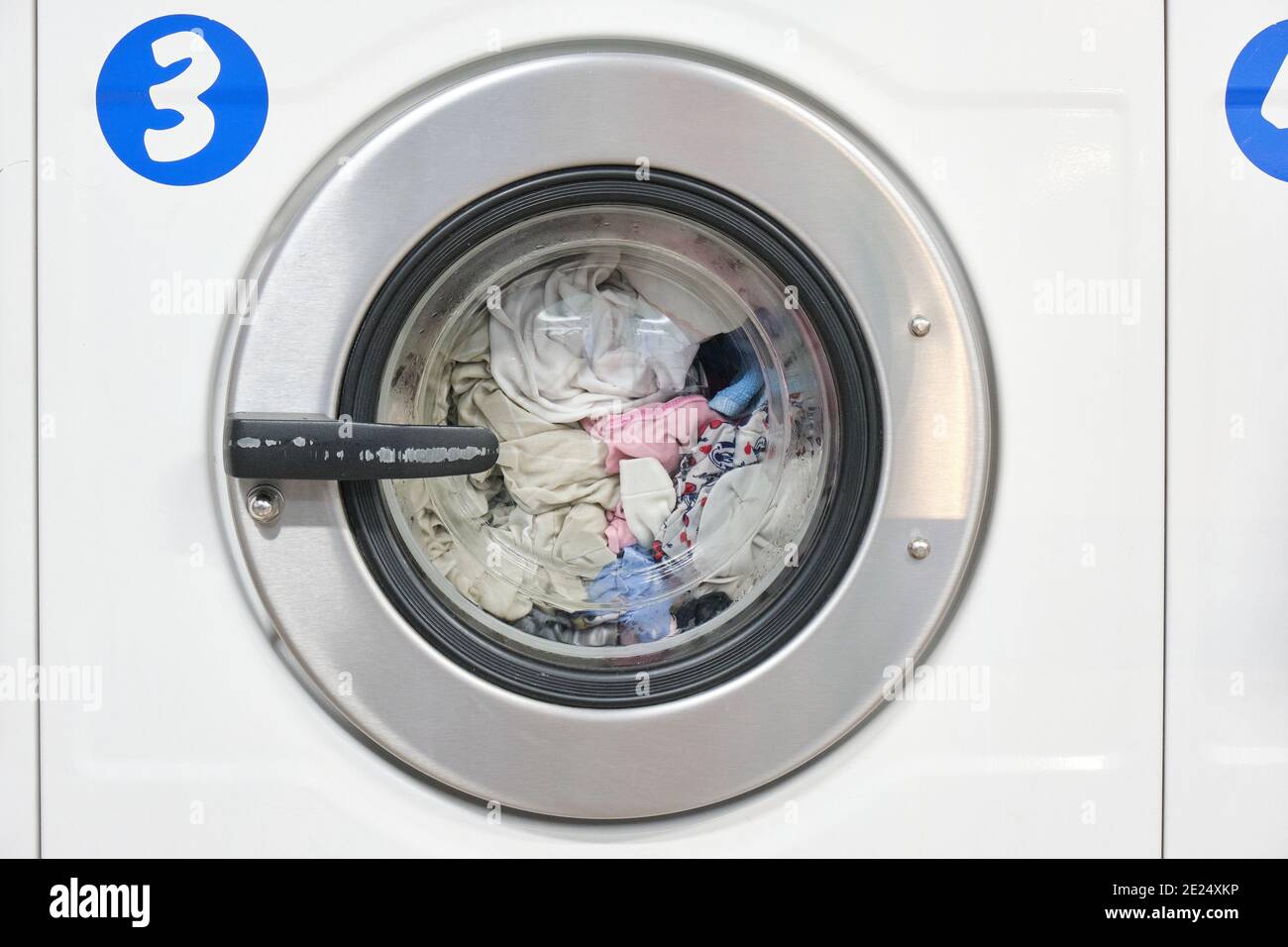 White Washing Machine At laundry front view Stock Photo Alamy