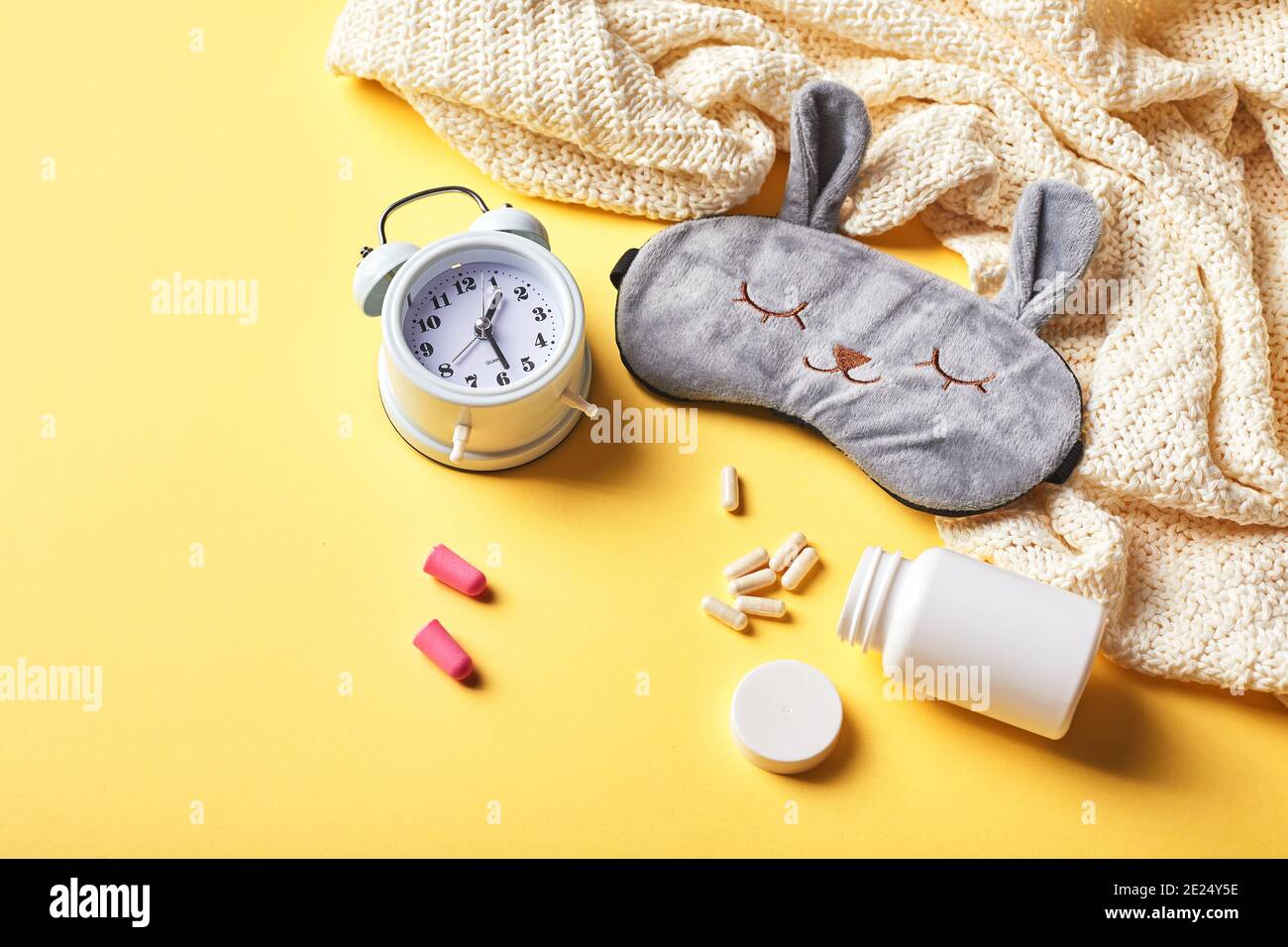 Sleeping mask, alarm clock, earplugs and pills. Healthy night sleep