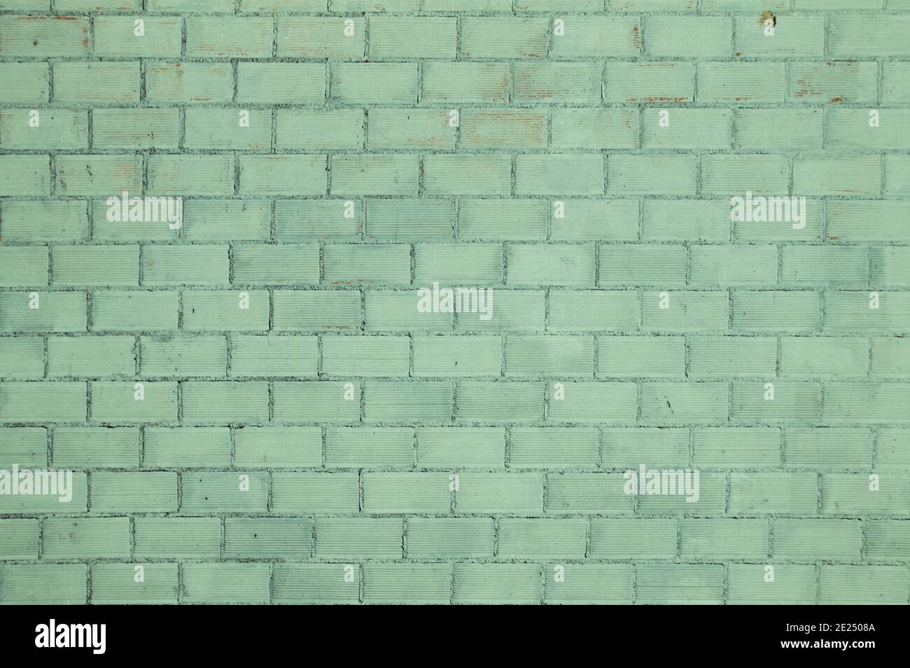Old green painted brickwall background Stock Photo