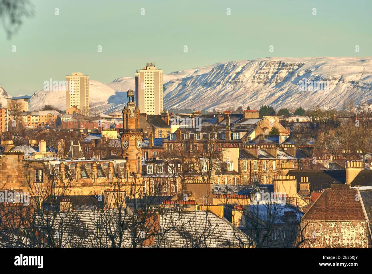 Snowy cityscape of the west end of glasgow on a beautiful winters day. Taken from Kelvingrove Park looking towards Campsie Fells. Stock Photo