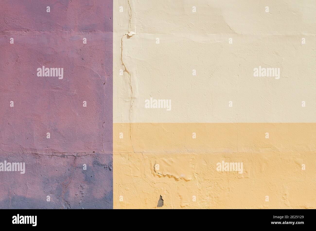 Pink and yellow painted wall, abstract background or texture Stock Photo