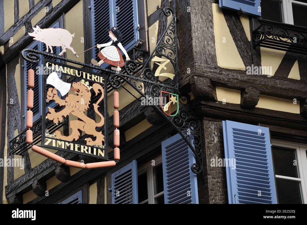 Colmar, Alsace, France. Half timbered buildings and charcuterie shop in town centre Stock Photo