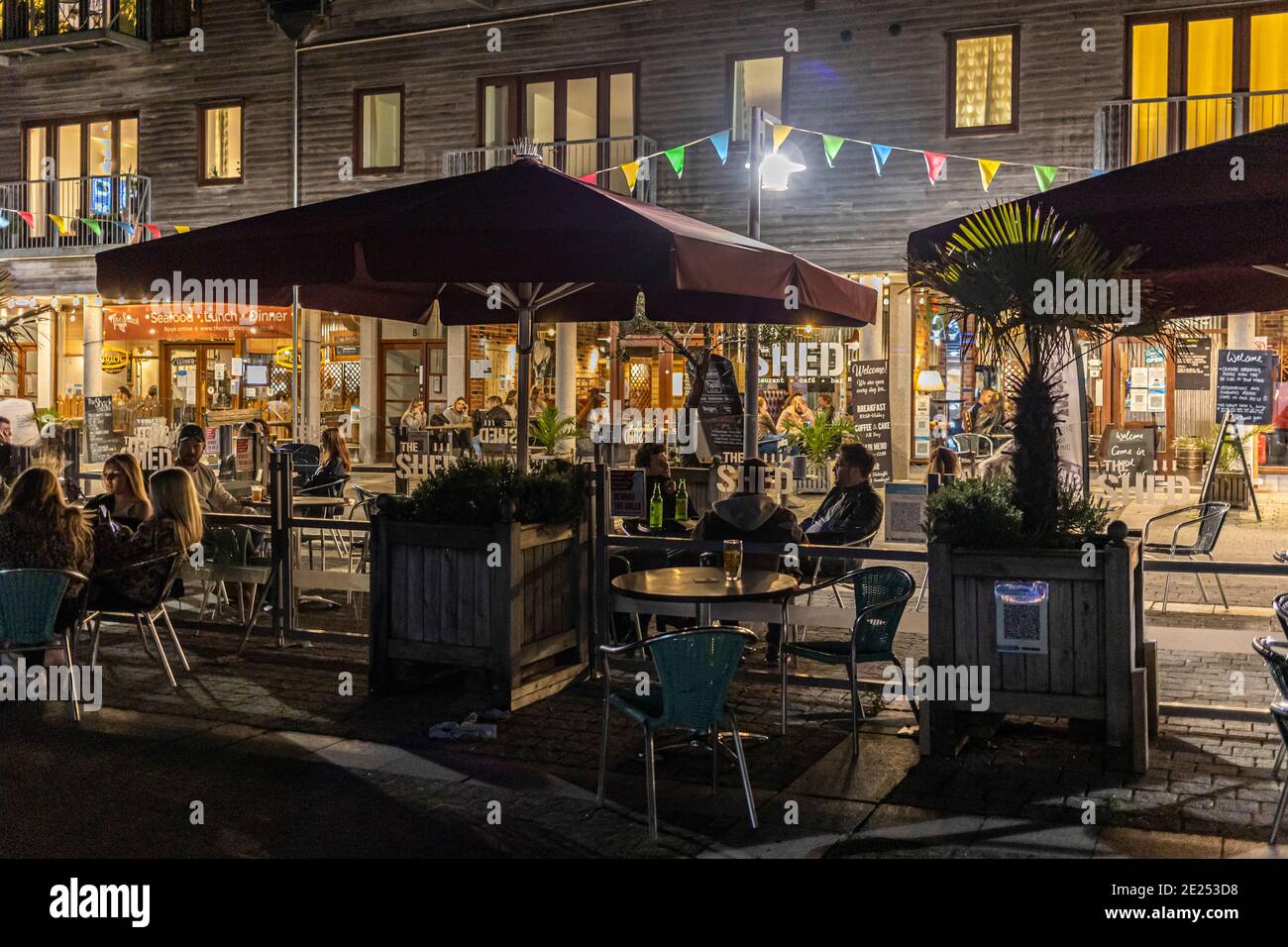 Dinners eating outside on the Falmouth Event square during the Coronaviris virus pandemic Stock Photo