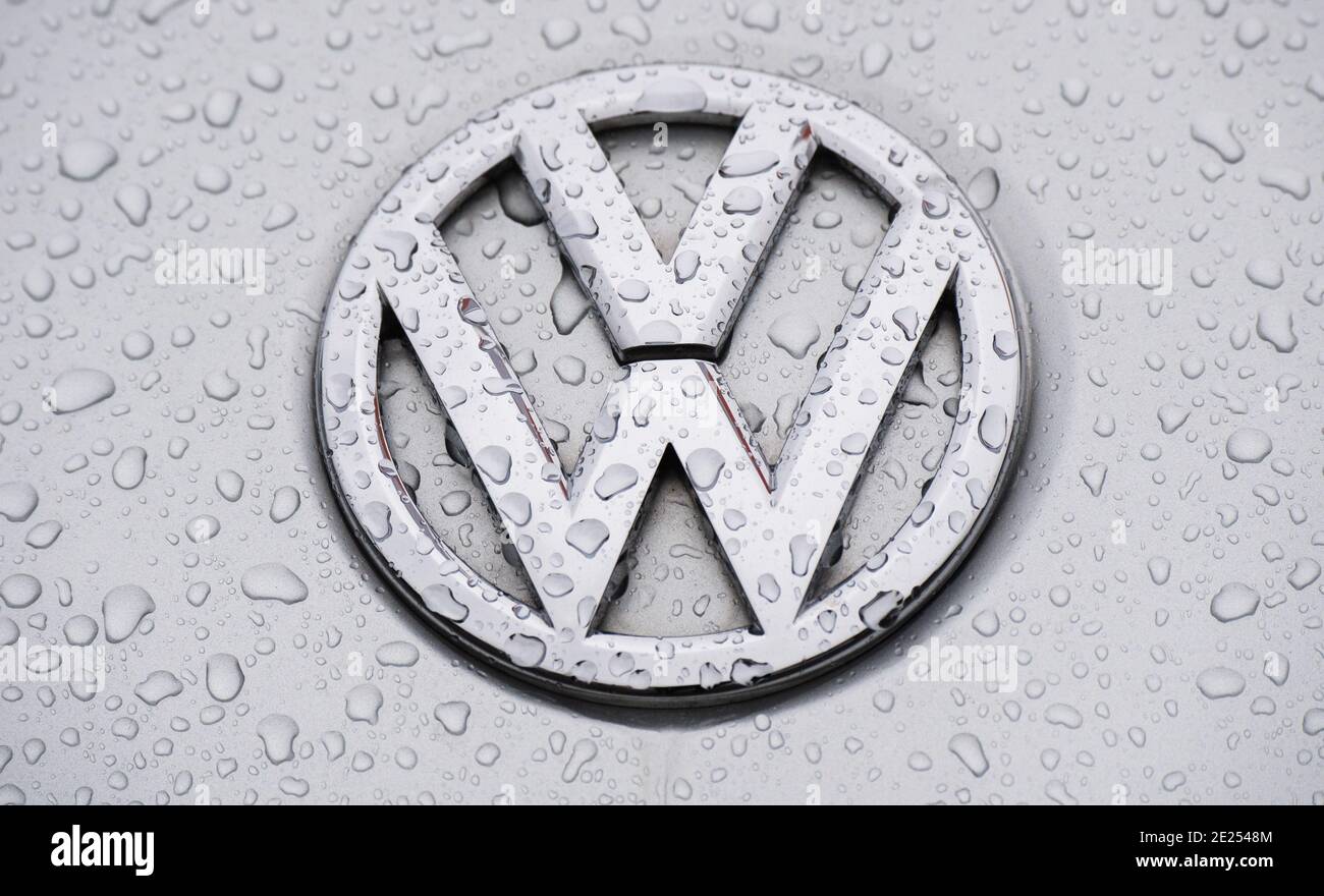 Hanover, Germany. 12th Jan, 2021. Raindrops bead on a Volkswagen logo at a VW dealer. The Corona crisis year of 2020 has also left its mark on Volkswagen's sales. Overall, deliveries of the core brand in the largest car group fell by 15.1 percent compared to 2019. Credit: Julian Stratenschulte/dpa/Alamy Live News Stock Photo