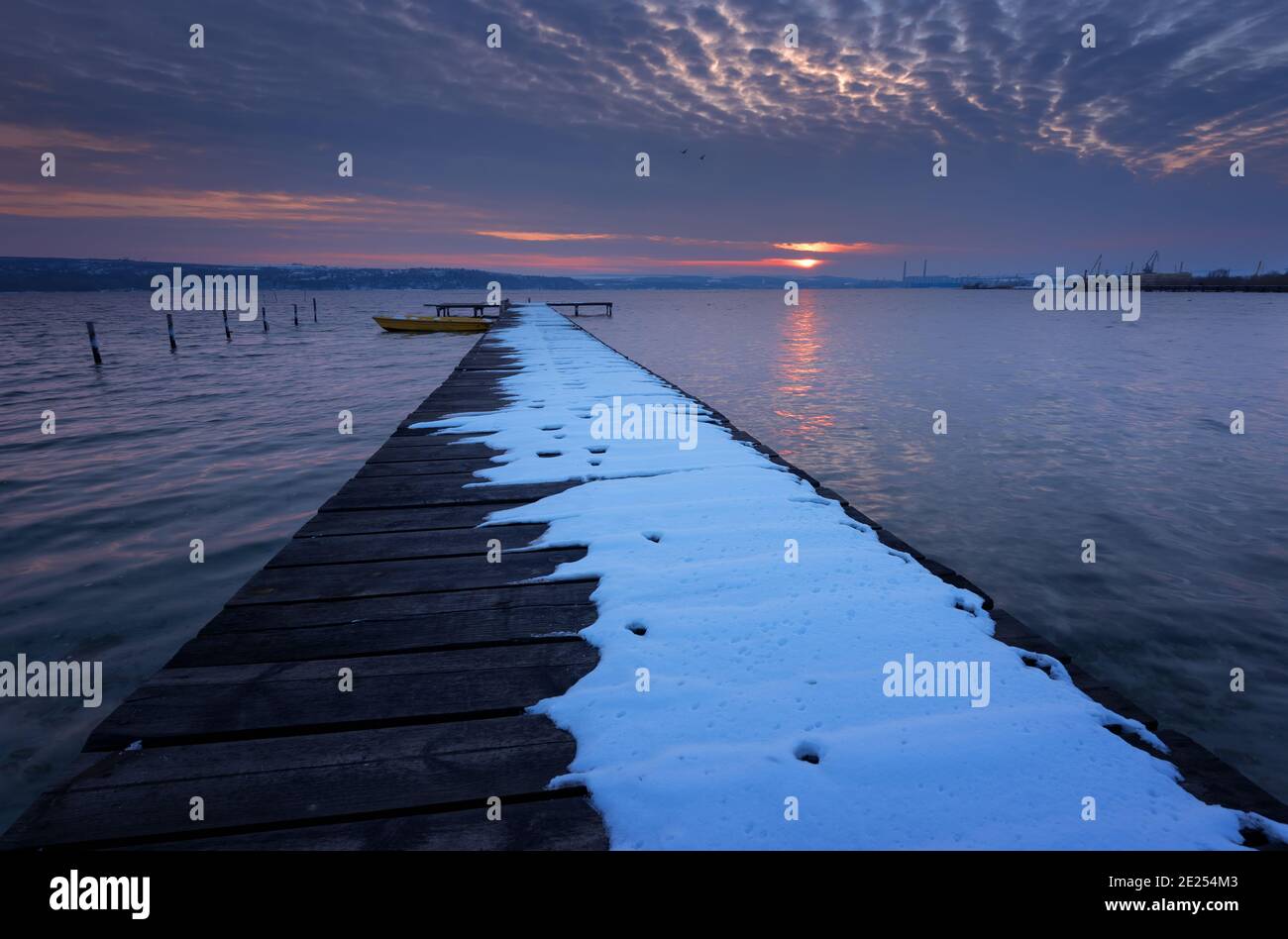 Seascape during sunset. Beautiful natural seascape, blue hour. Sea sunset at a lake coast near Varna, Bulgaria. Magnificent sunset with clouds in the Stock Photo