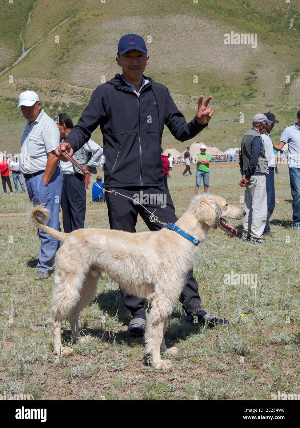 Breeders of kyrgysz hunting dog, Taigan, during a competition. Folk and Sport festival on the Suusamyr plain commemorating Mr Koshomkul, a sportsman a Stock Photo