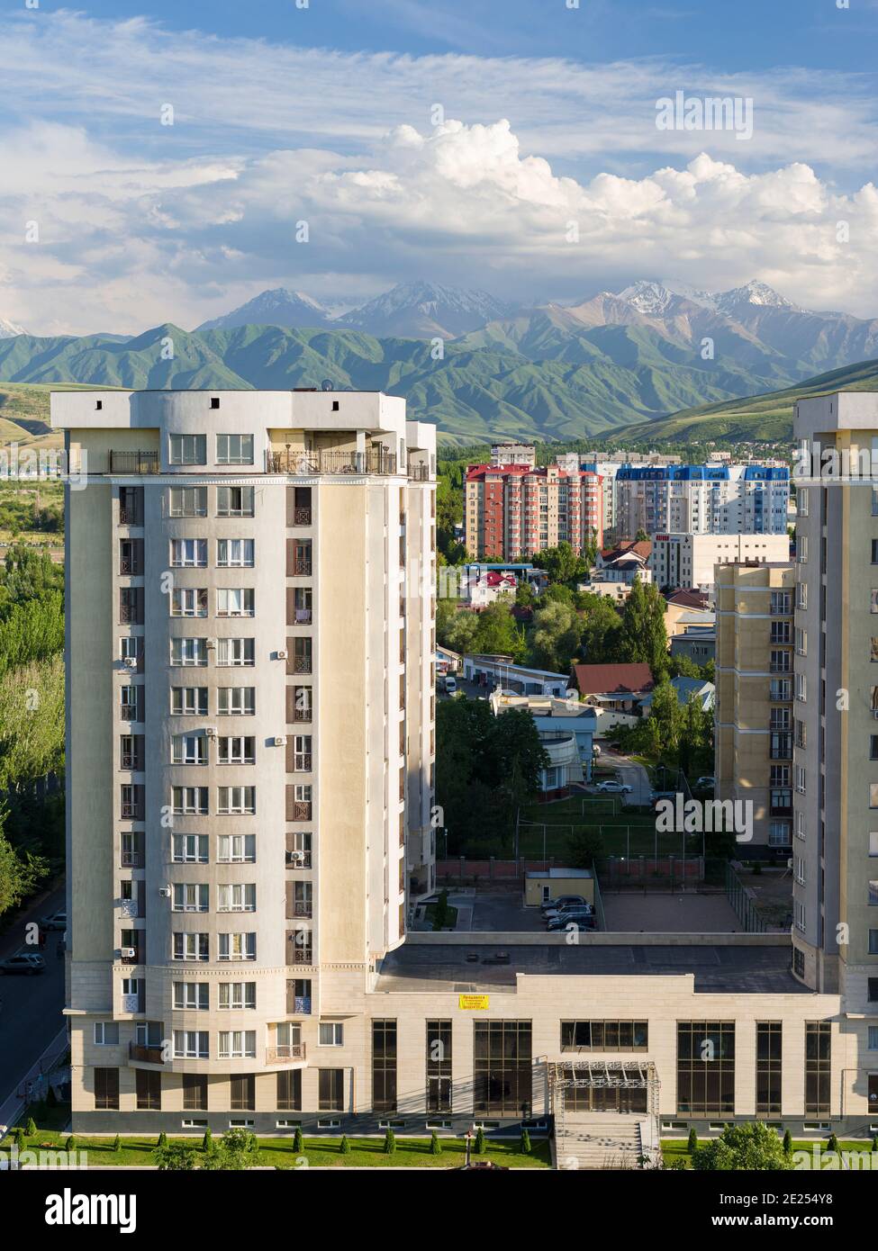 Image showcasing Cityview with modern high rise buildings, background the mountains of ...