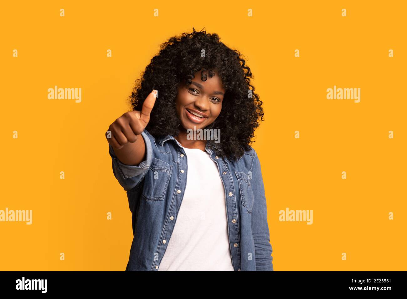 Joyful young woman showing thumb hi-res stock photography and images ...