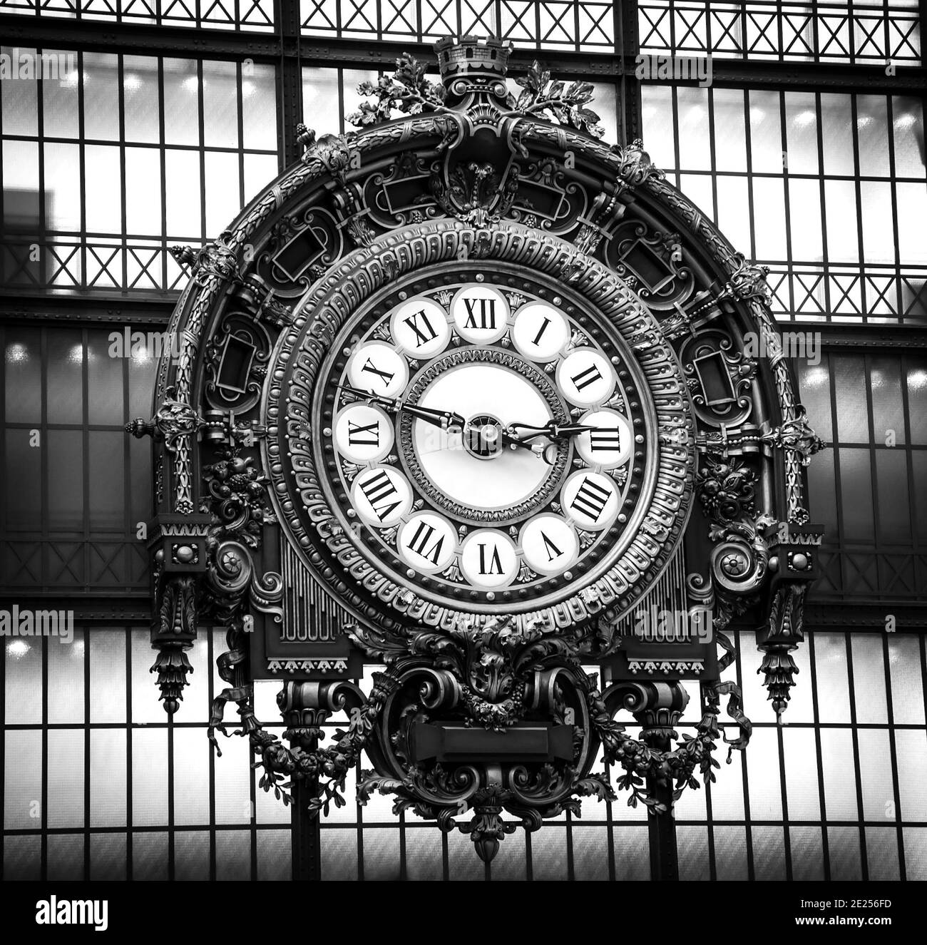 Golden clock in museum D'Orsay in (Paris, France) owning largest collection of impressionist and post-impressionist paintings in world. Black white Stock Photo