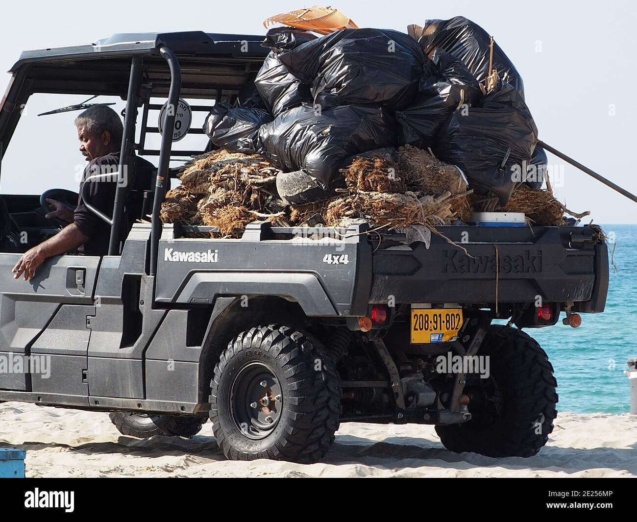 Israel. Garbage collection on Zikim beach. Stock Photo
