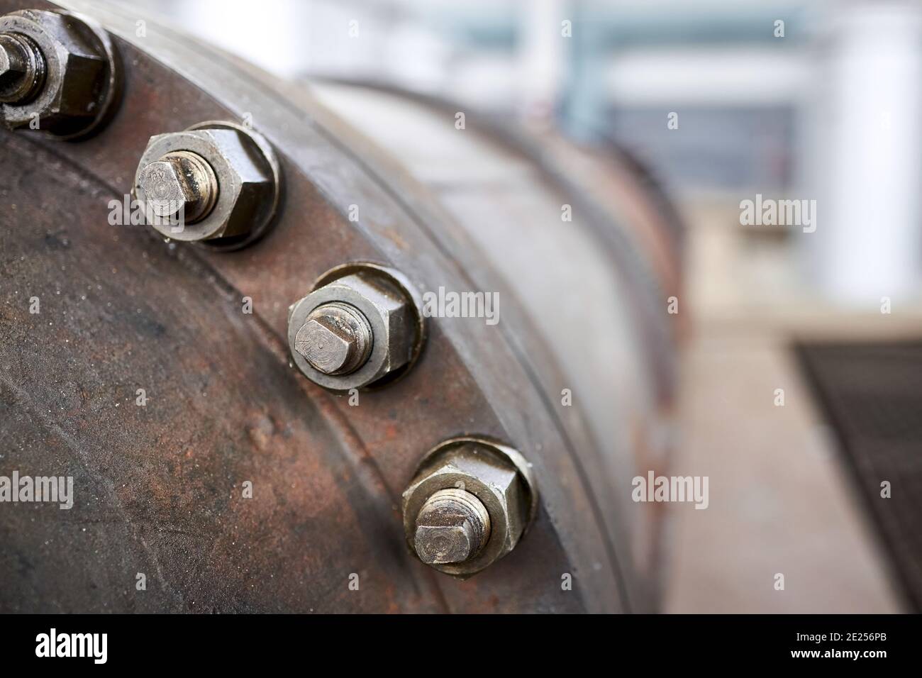 Sealing connection bolted screw connection, on manhole of industrial machine compressor or pump on chemical plant selective focus with out of focus Stock Photo