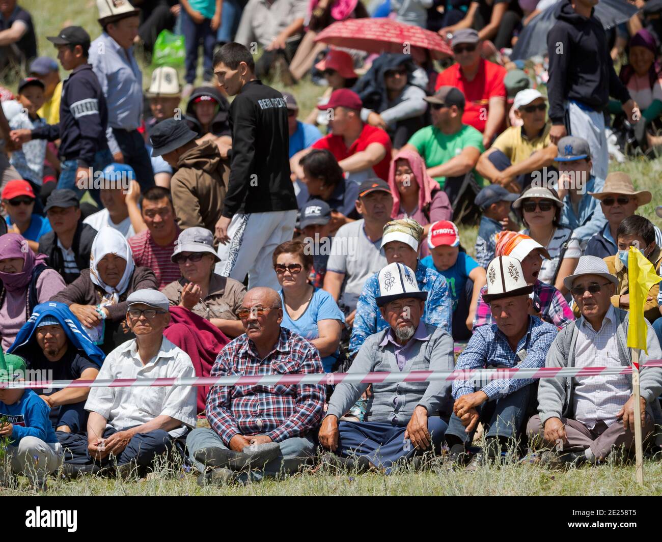 Spectators.  Kuresh, traditional Kyrgyz wrestling.   Folk and Sport festival on the Suusamyr plain commemorating Mr Koshomkul, a sportsman and folk he Stock Photo