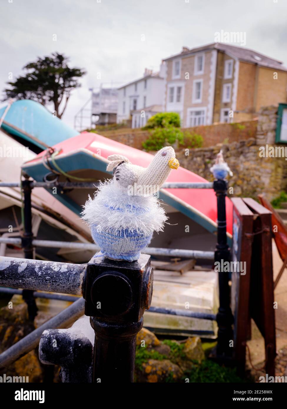 Knitted seagulls atop railings at Seaview on the Isle of Wight Stock Photo