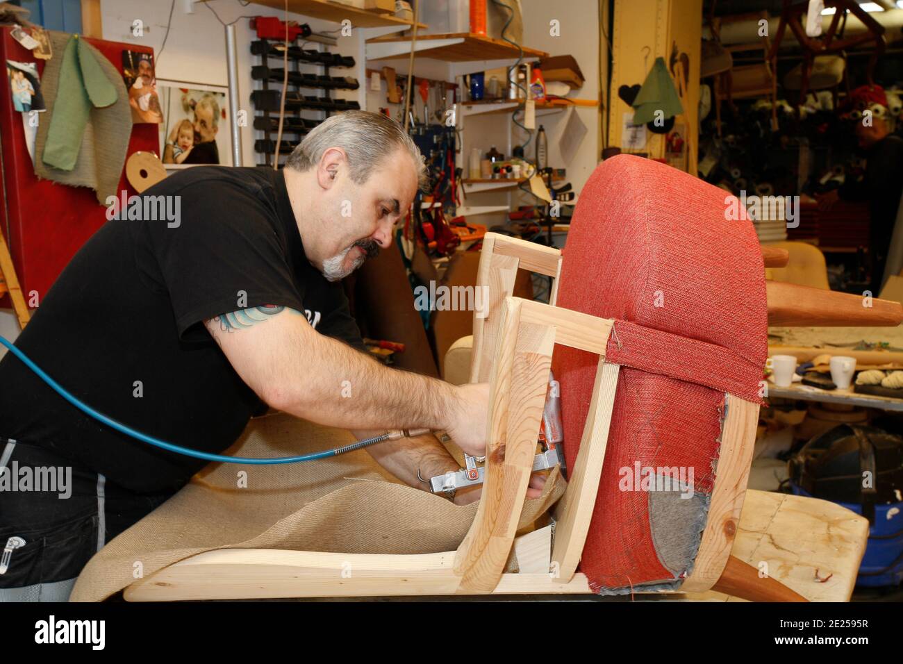 Portrait of upholsterer working in workshop, Solna, Sweden. Stock Photo