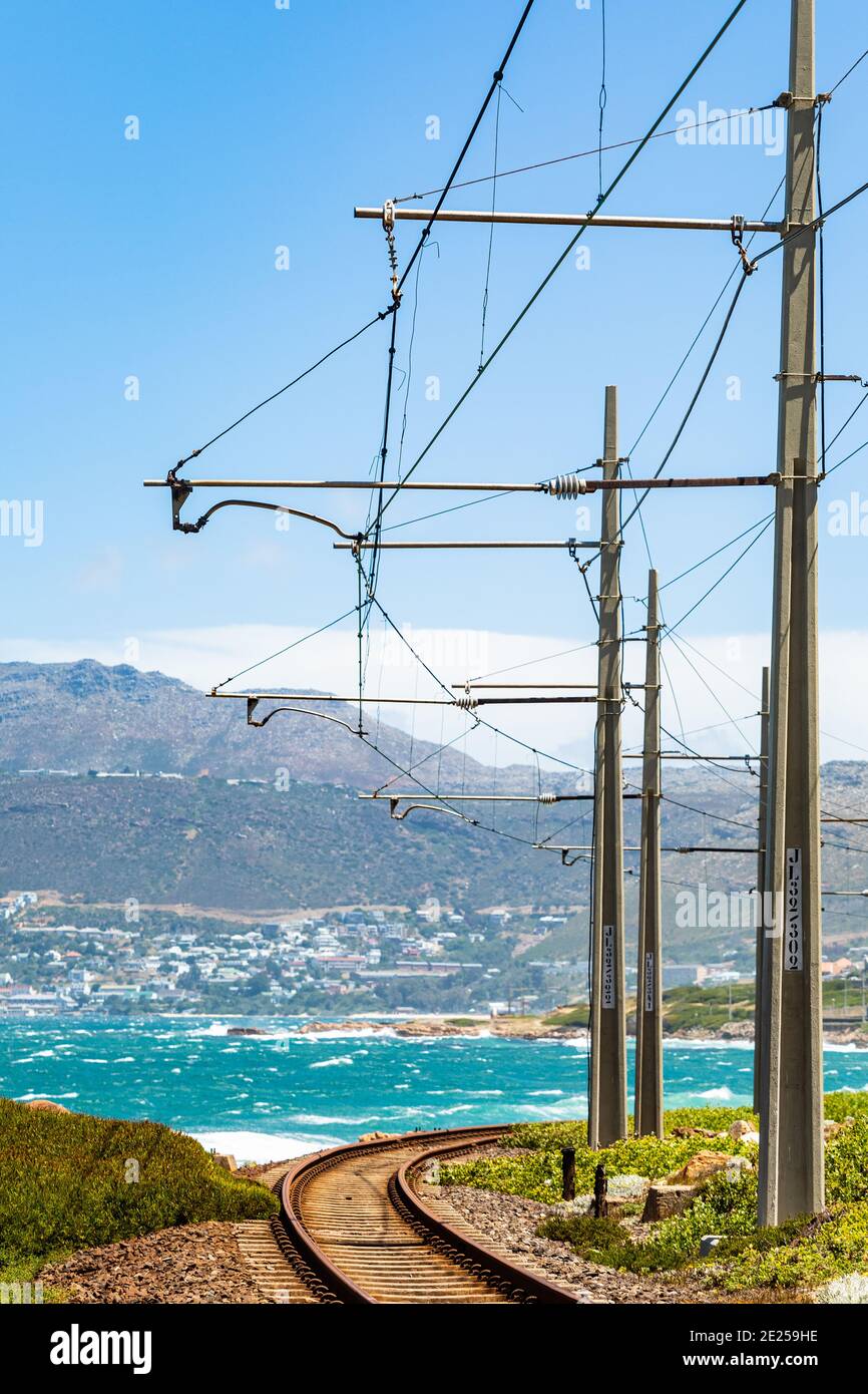 Vertical shot of electrical power lines along the railway in Cape Town, South Africa at the