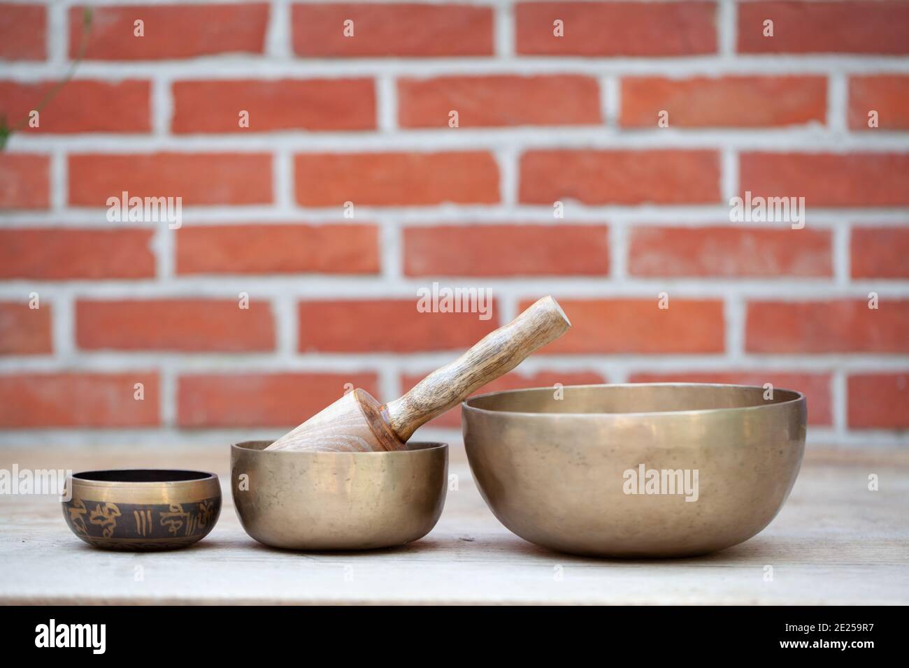 Tibetan singing bowls with sticks on the wall background music