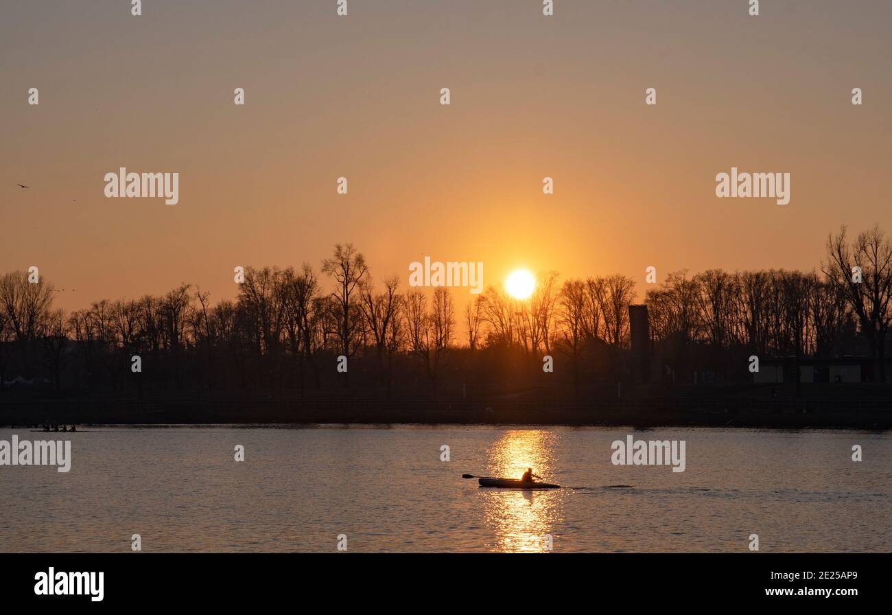 Canoeist in action at sunset., Milan. Italy Stock Photo
