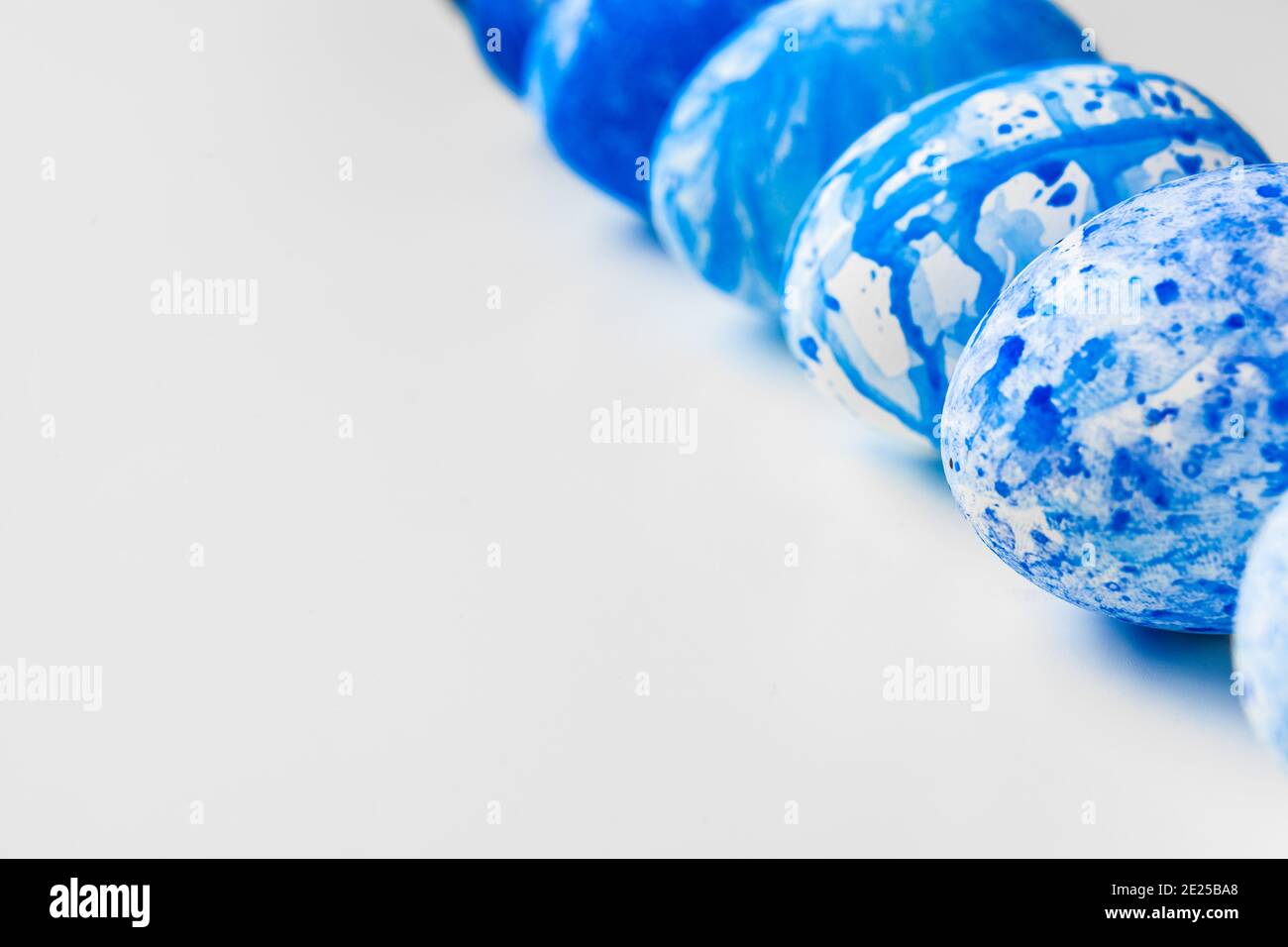 blue Easter eggs isolated on white Stock Photo - Alamy