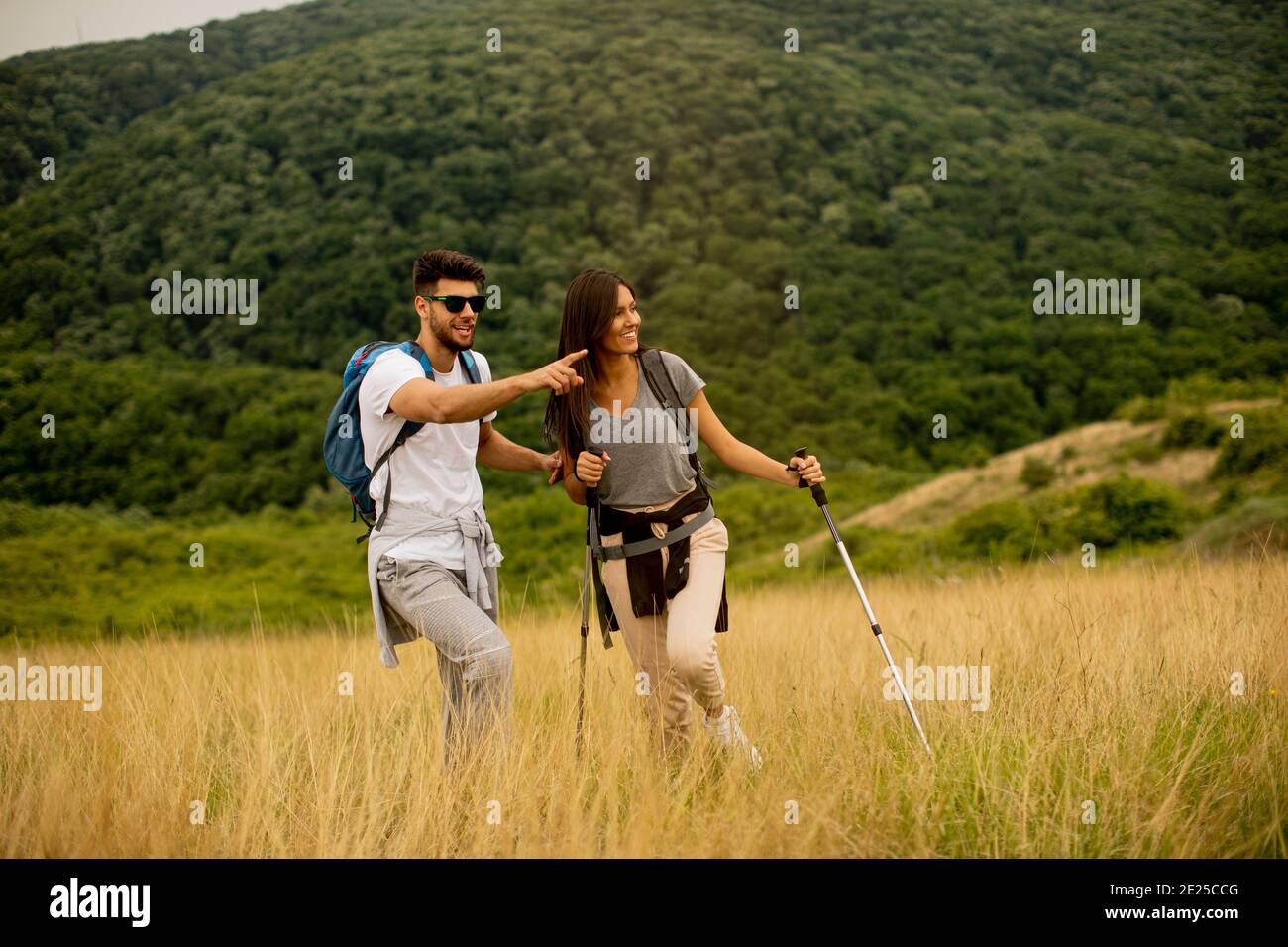 Young man walking over field hi-res stock photography and images - Alamy