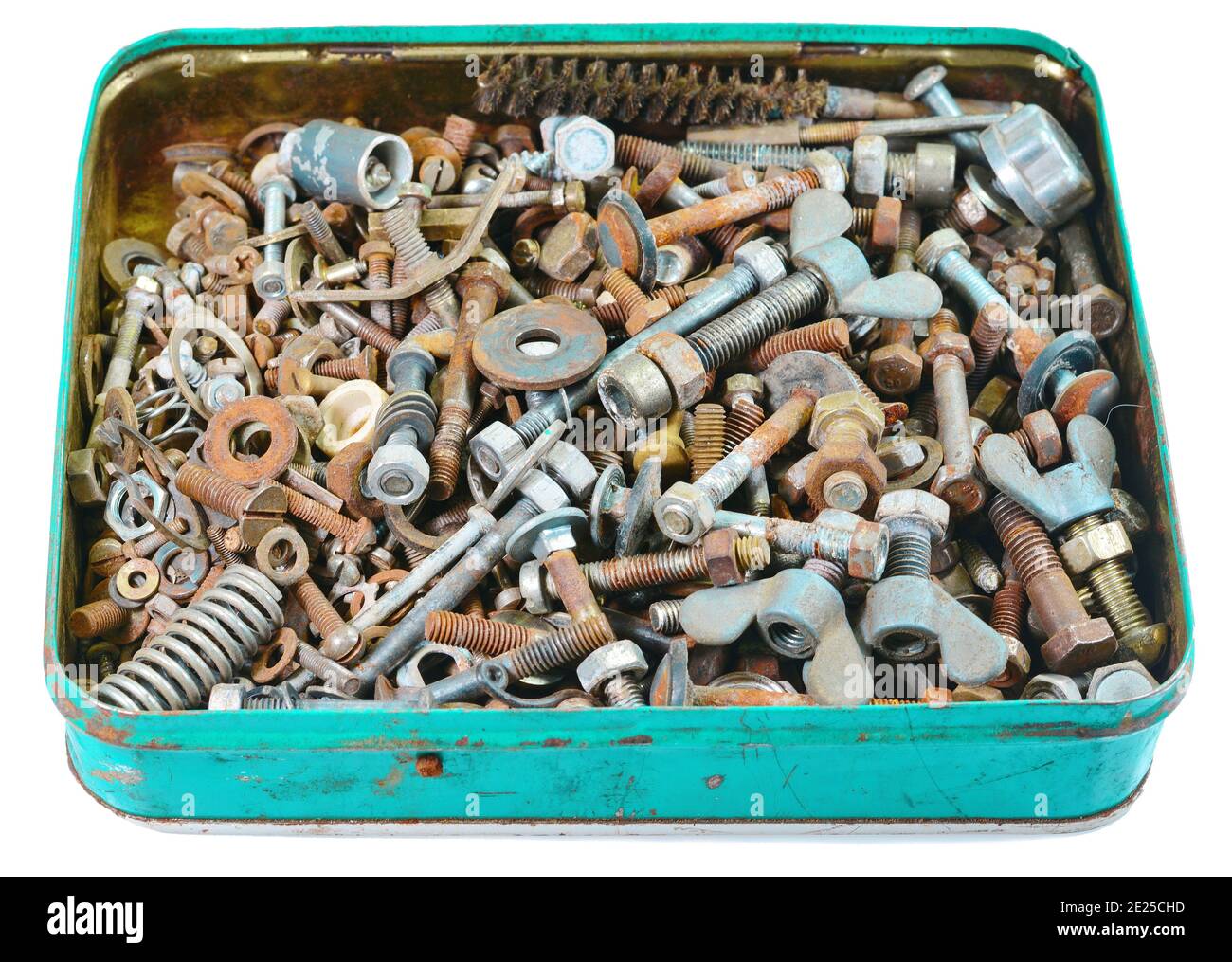Old rusty bolts, screws, nuts, screws, brackets, various metal details in a metal box. Stock Photo
