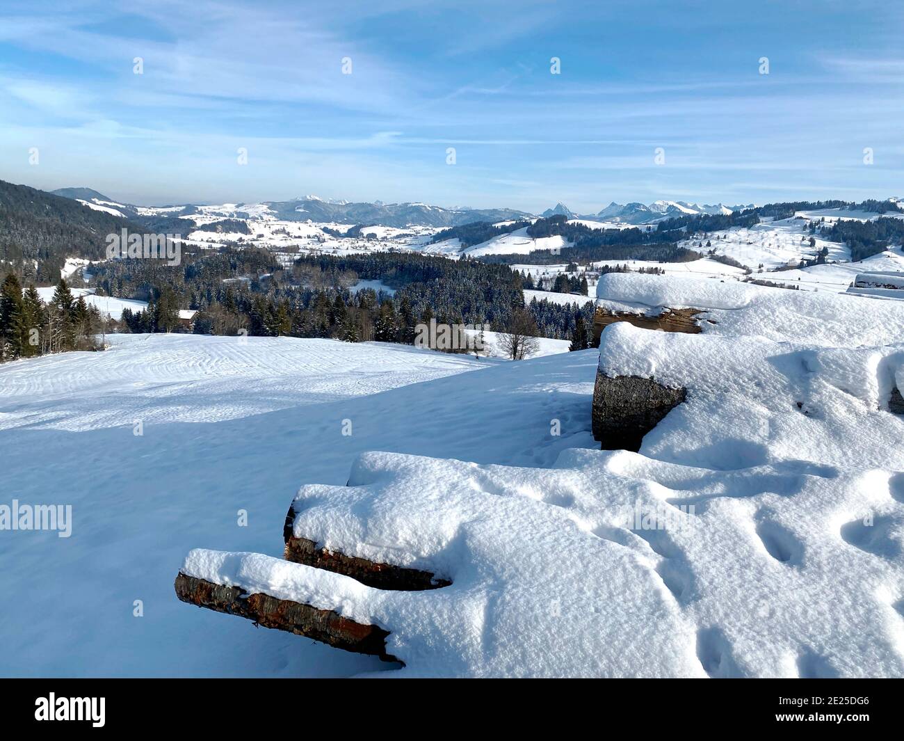 View of snow covered hills and fields near Sattle, Zug, Switzerland Stock Photo