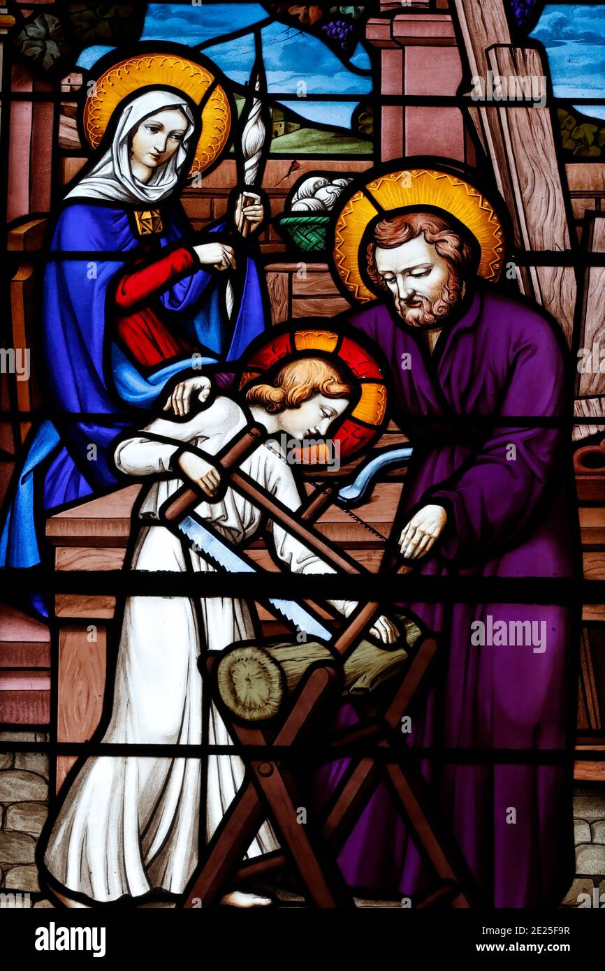 Stained glass window. Holy family. Joseph the carpenter.  France. Stock Photo