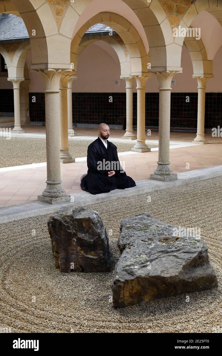 Zen buddhist monk practising zazen (meditation) in Orval trappist abbey ...