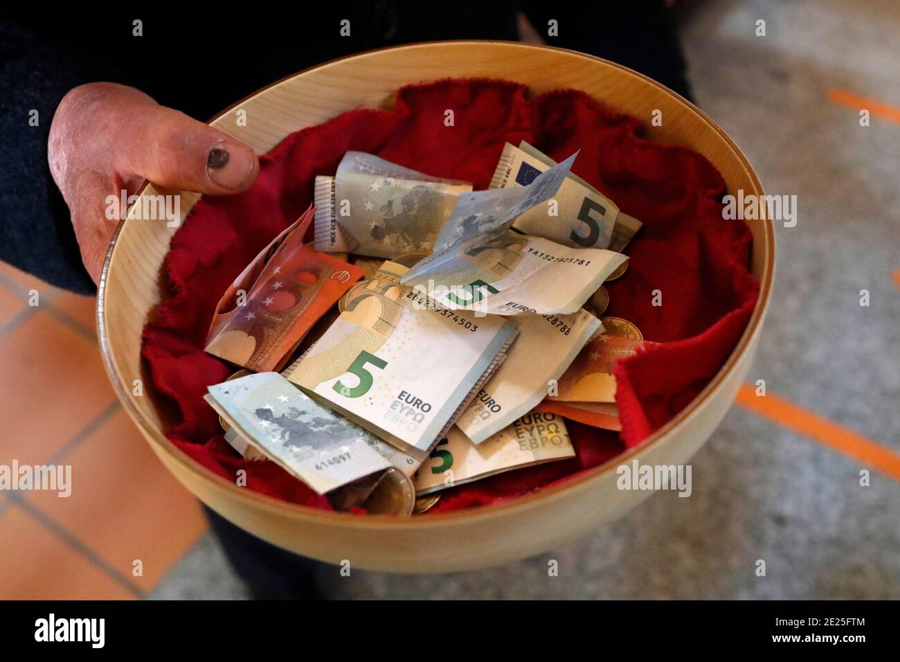 Collection during a catholic mass. Basket with Euros. Sallanches. France  Stock Photo - Alamy