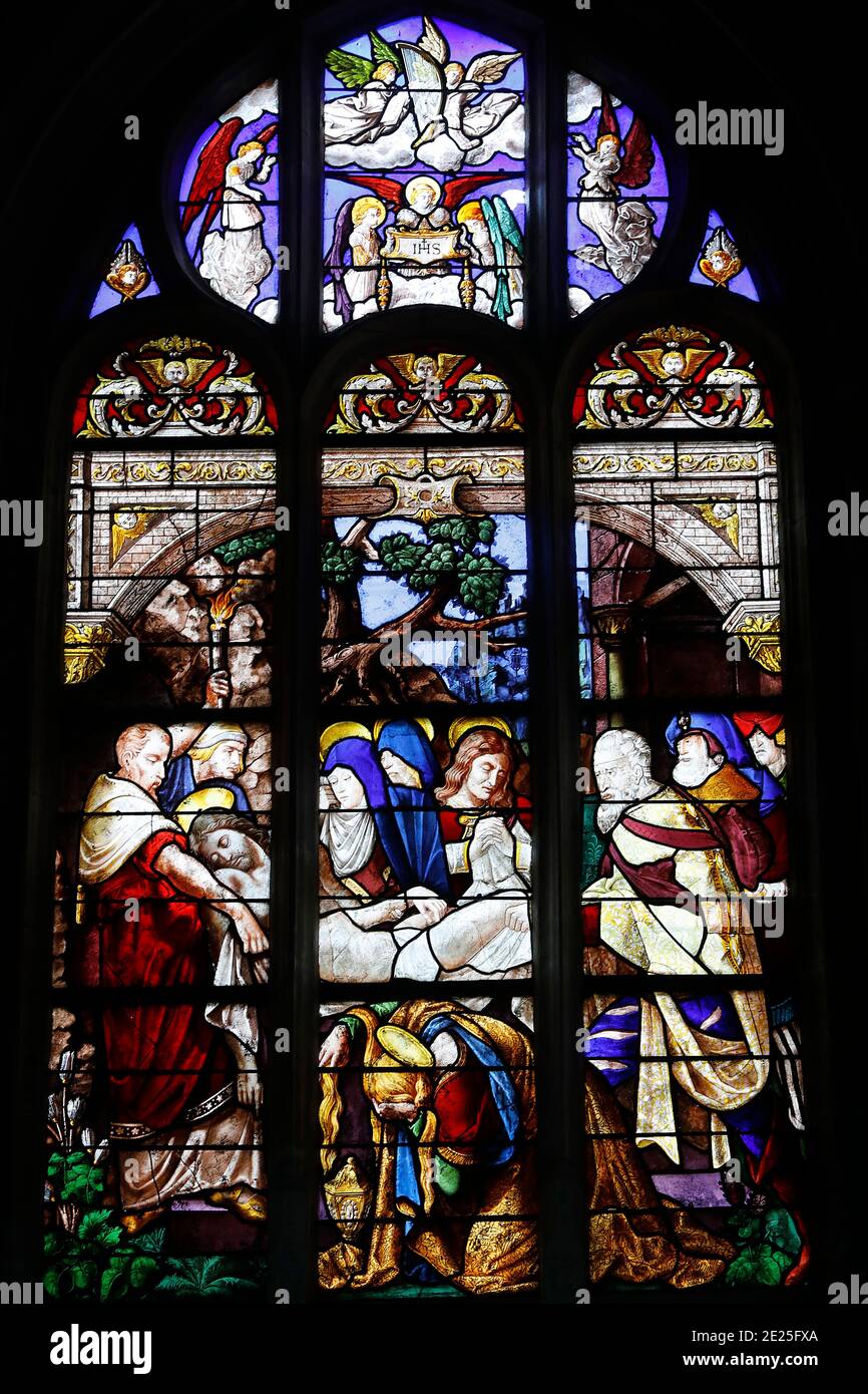Stained glass in St Martin's church, Broglie, France. Jesus's entombment. Stock Photo
