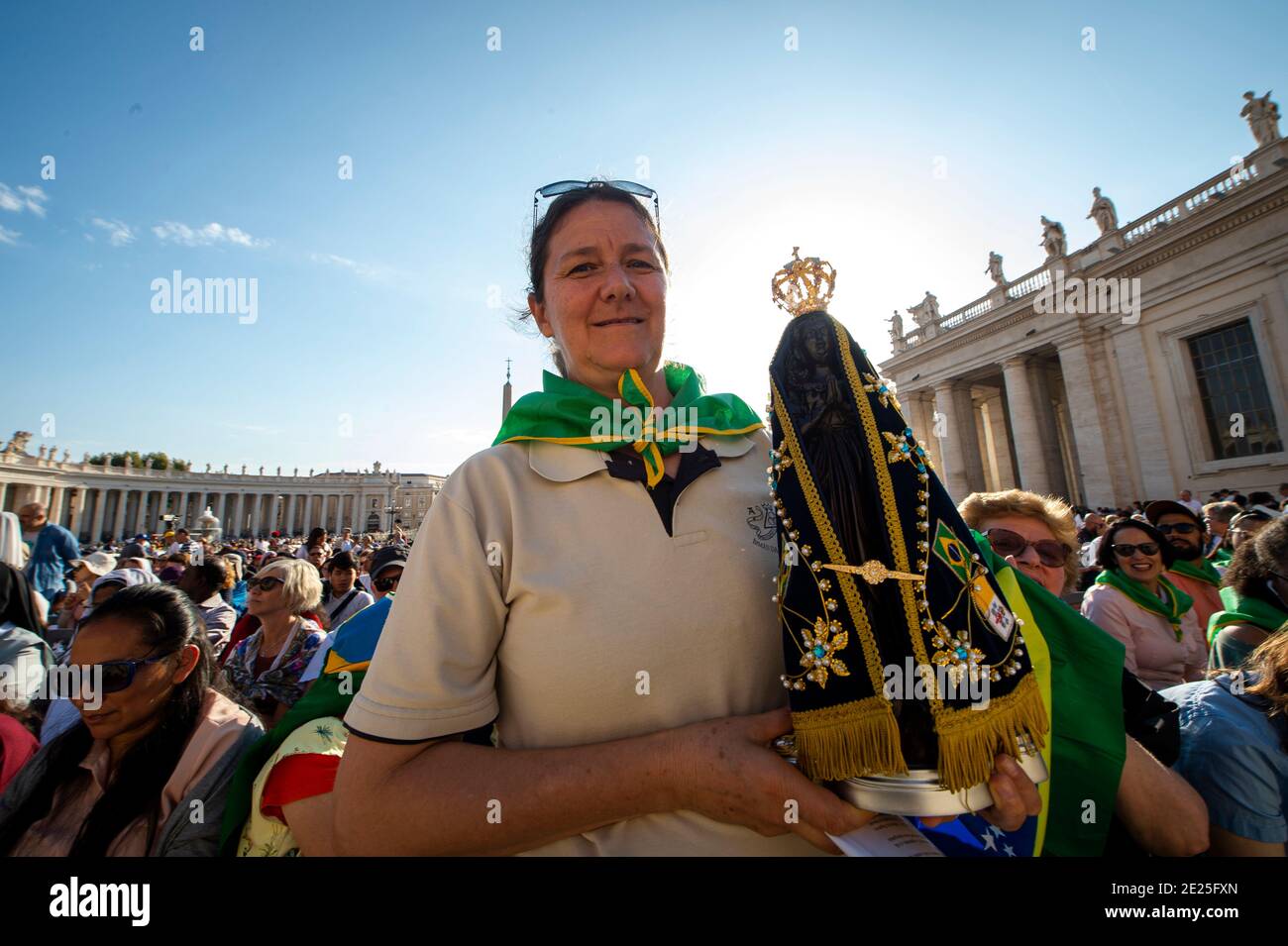 A Brazilian woman holds an Our Lady of Aparecida statue during Pope Francis's Holy Mass on the occasion of the Migrant and Refugee World Day, in St. P Stock Photo
