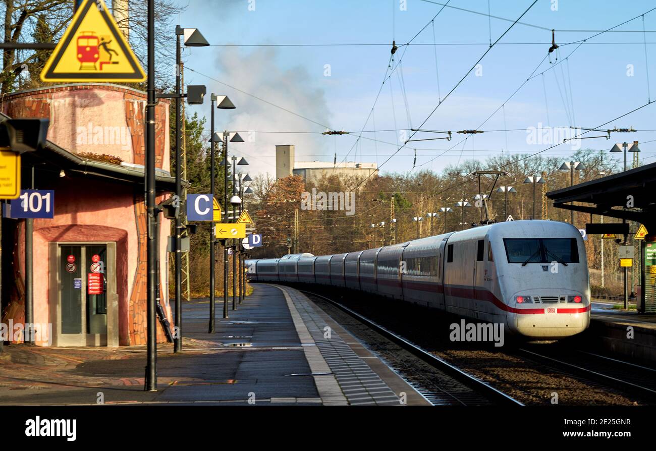 Uelzen, Germany, December 18., 2020: Arrival of a passenger train on the platform of the station Stock Photo