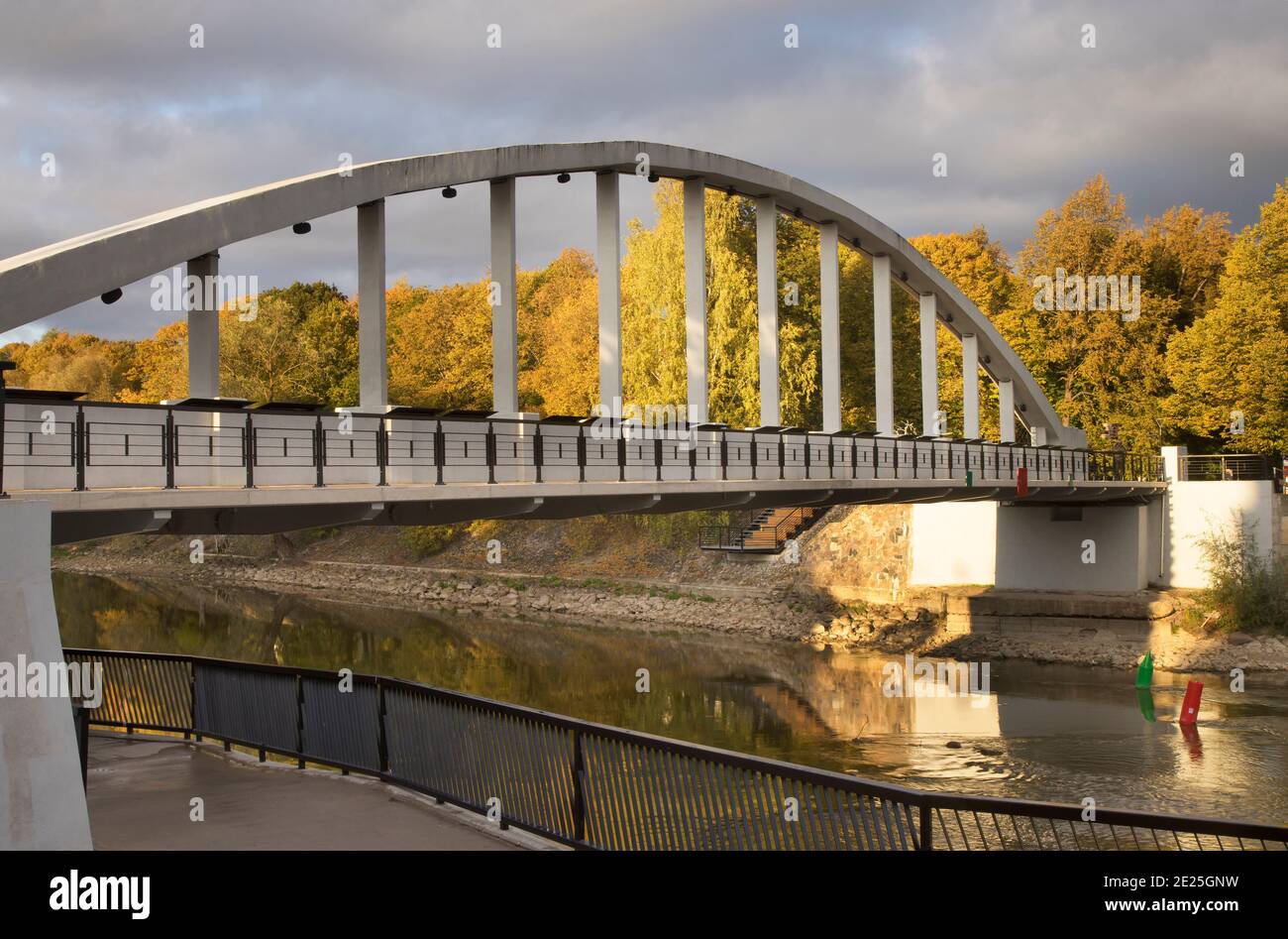 Arch bridge - Kaarsild over Suur Emajogi river and River park - Ulejoe in Tartu. Estonia Stock Photo