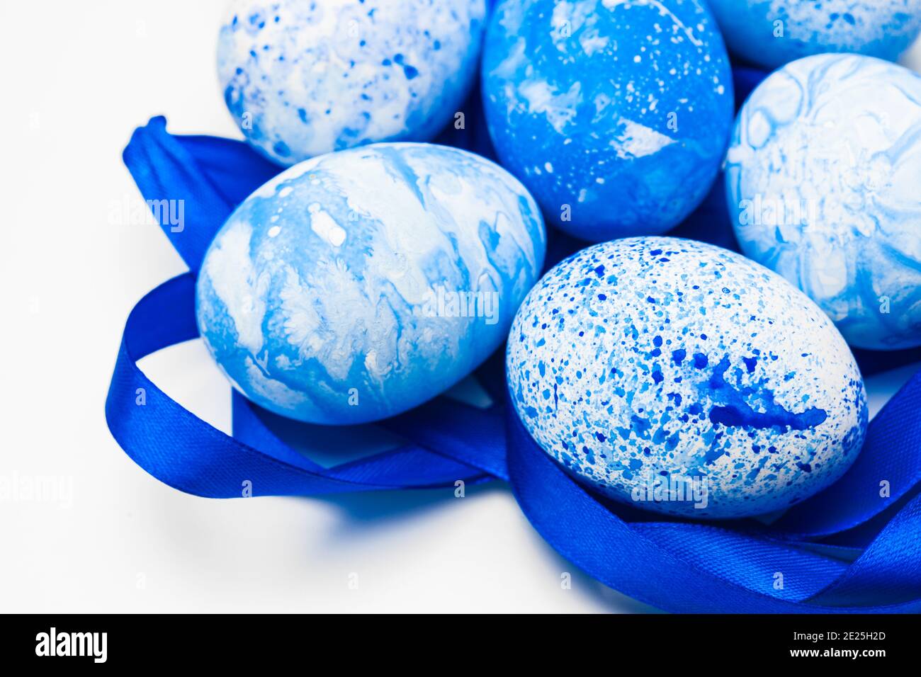 blue Easter eggs isolated on white Stock Photo - Alamy