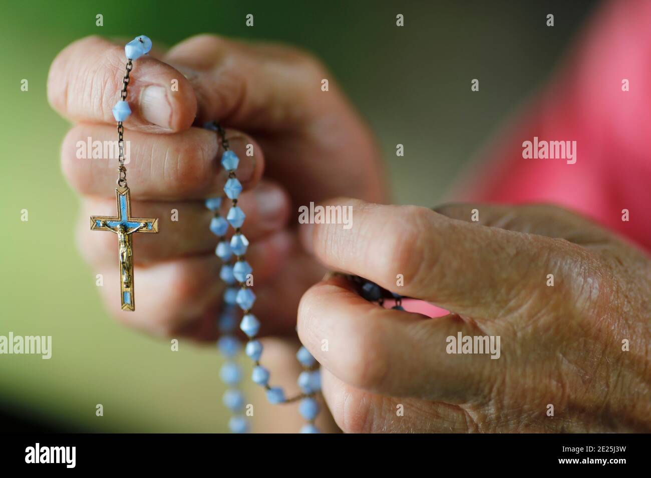 Man prayer the rosary. Close uo on hands.  France. Stock Photo