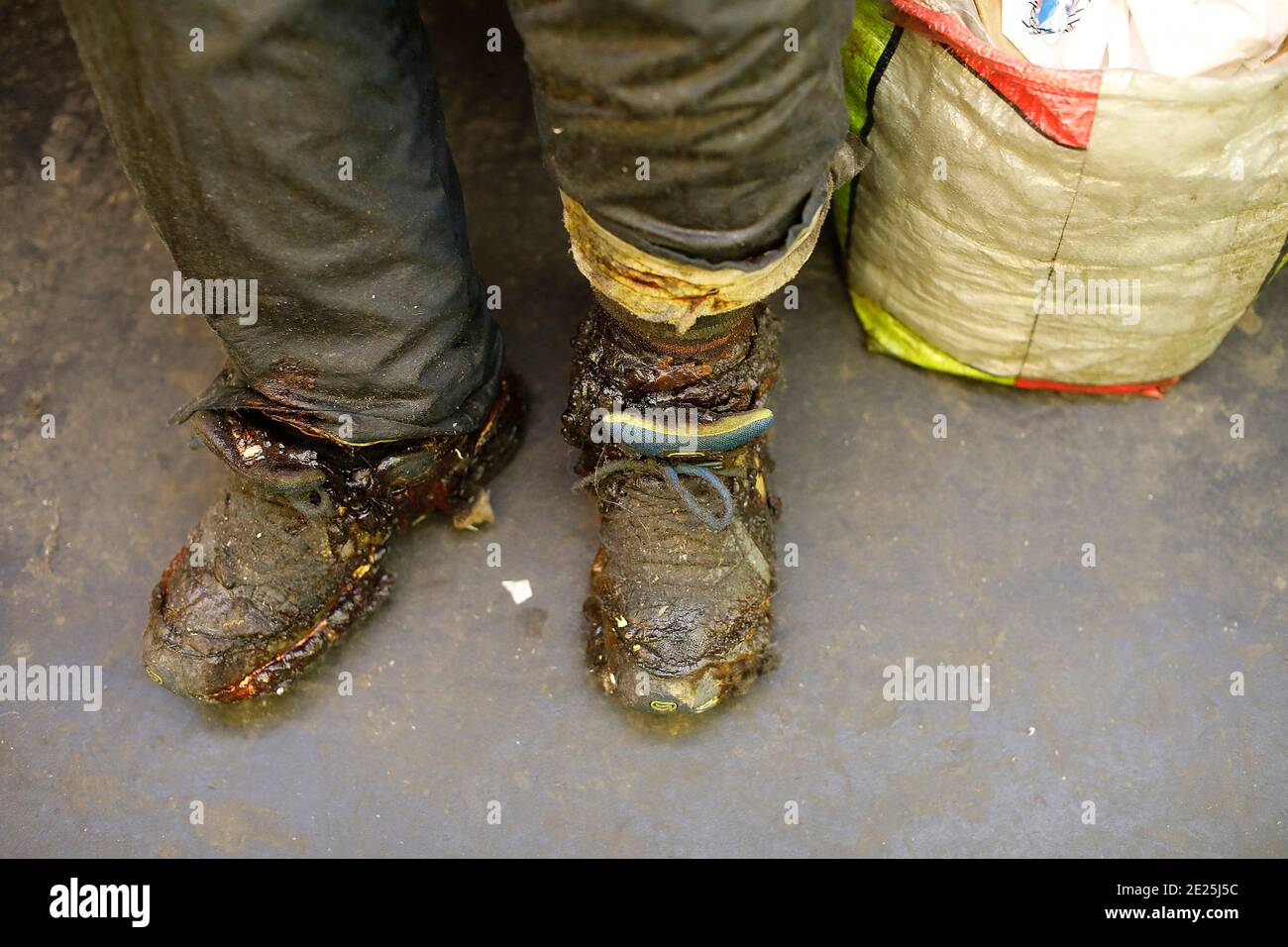 Homeless man's shoes in Paris, France Stock Photo