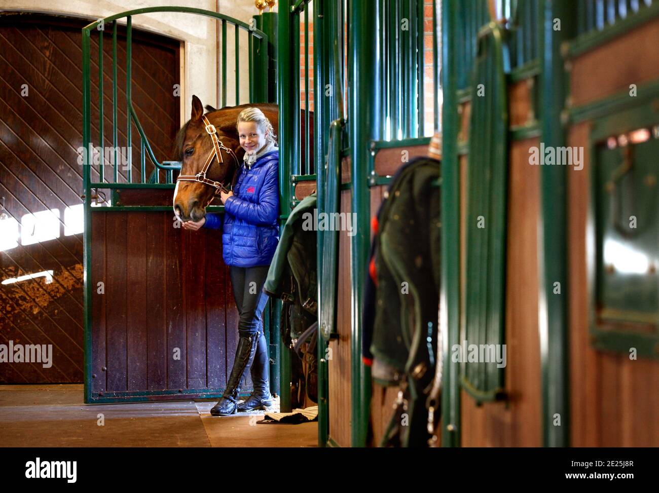 JONSTORP, SWEDEN- 16 NOVEMBER 2012: Malin Baryard Johnsson with the stable's star Tornesch also called 'Tore'. Stock Photo