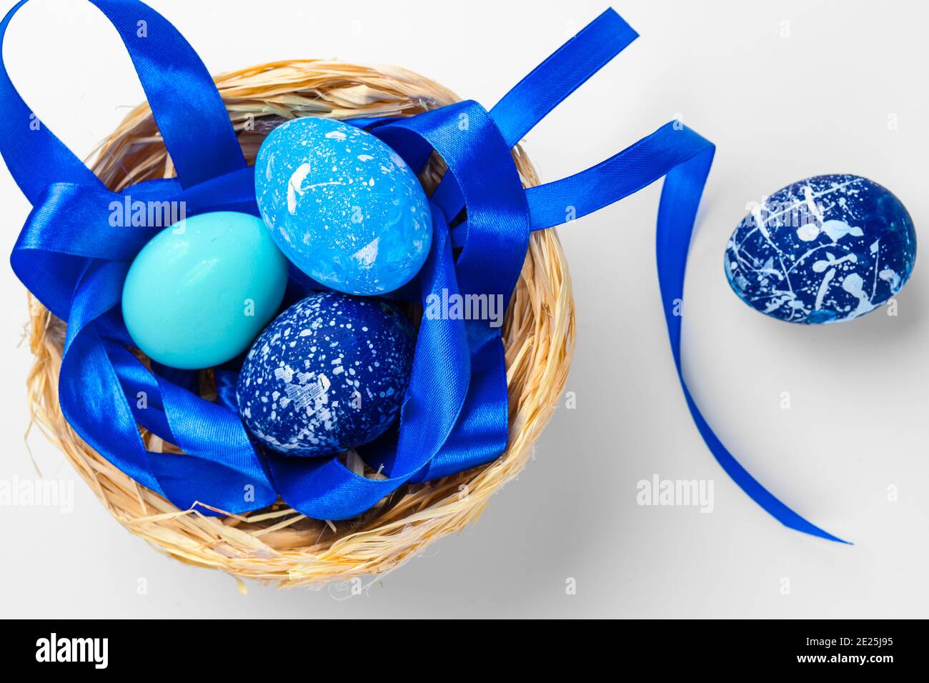 blue Easter eggs isolated on white Stock Photo - Alamy