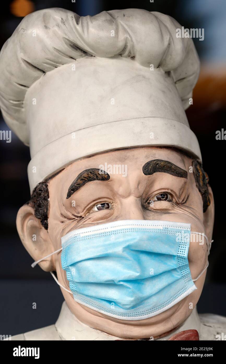 Restaurant. Mannequin with surgical mask.  Geneva.  Switzerland. Stock Photo