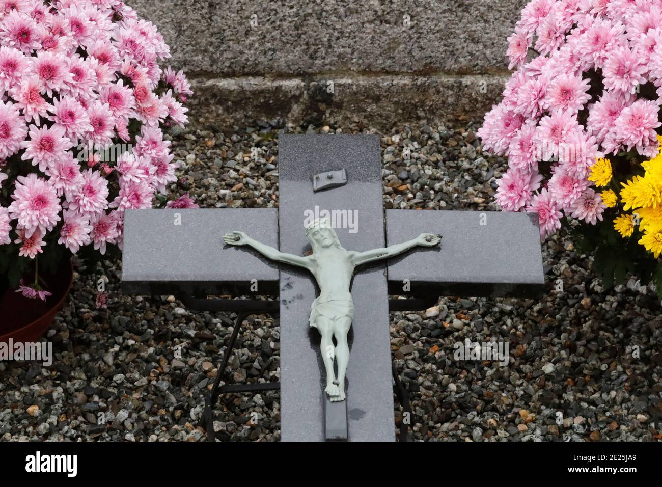 All Saints Day in a cemetery. Crucifix. Jesus on the cross. France