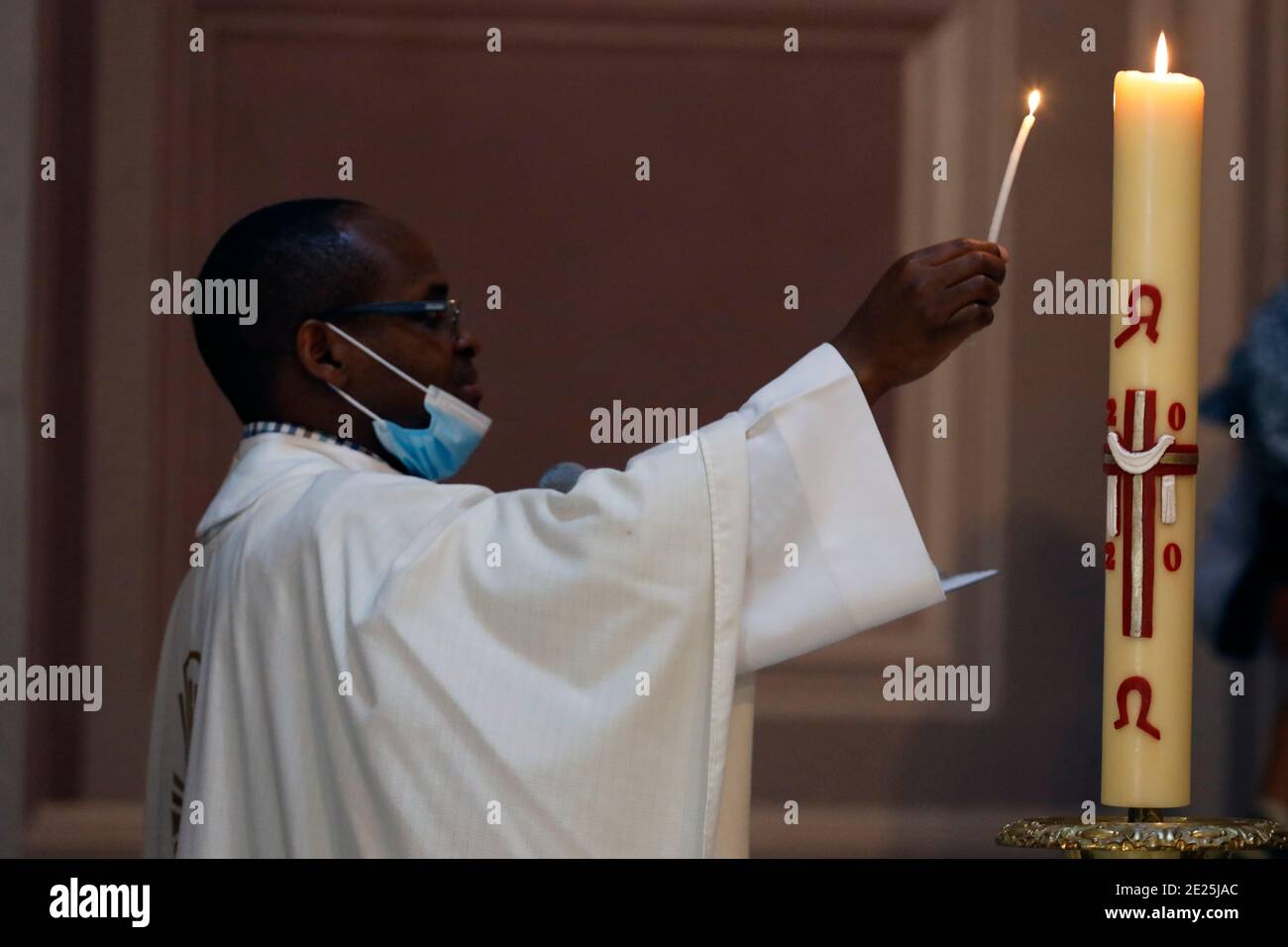 Catholic church. Baptismal liturgy. Catholic priest celebrates baptism