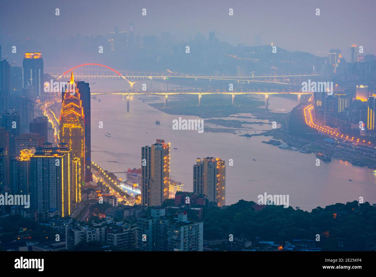 Chongqing, China downtown city skyline over the Yangtze River at sunset. Stock Photo