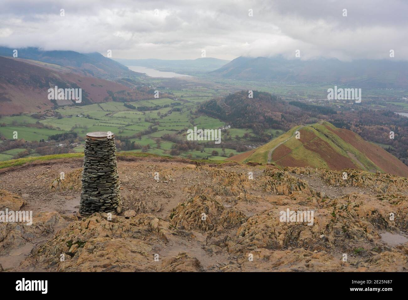Trig point on Cat Bells with Skelgill Bank and Bassenthwaite Lake, Lake District Stock Photo
