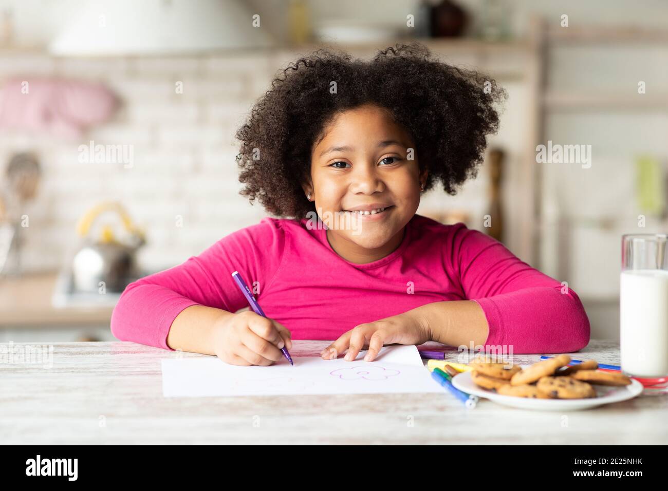 Portrait Of Happy Cute Little Black Girl Drawing In Kitchen Stock Photo ...