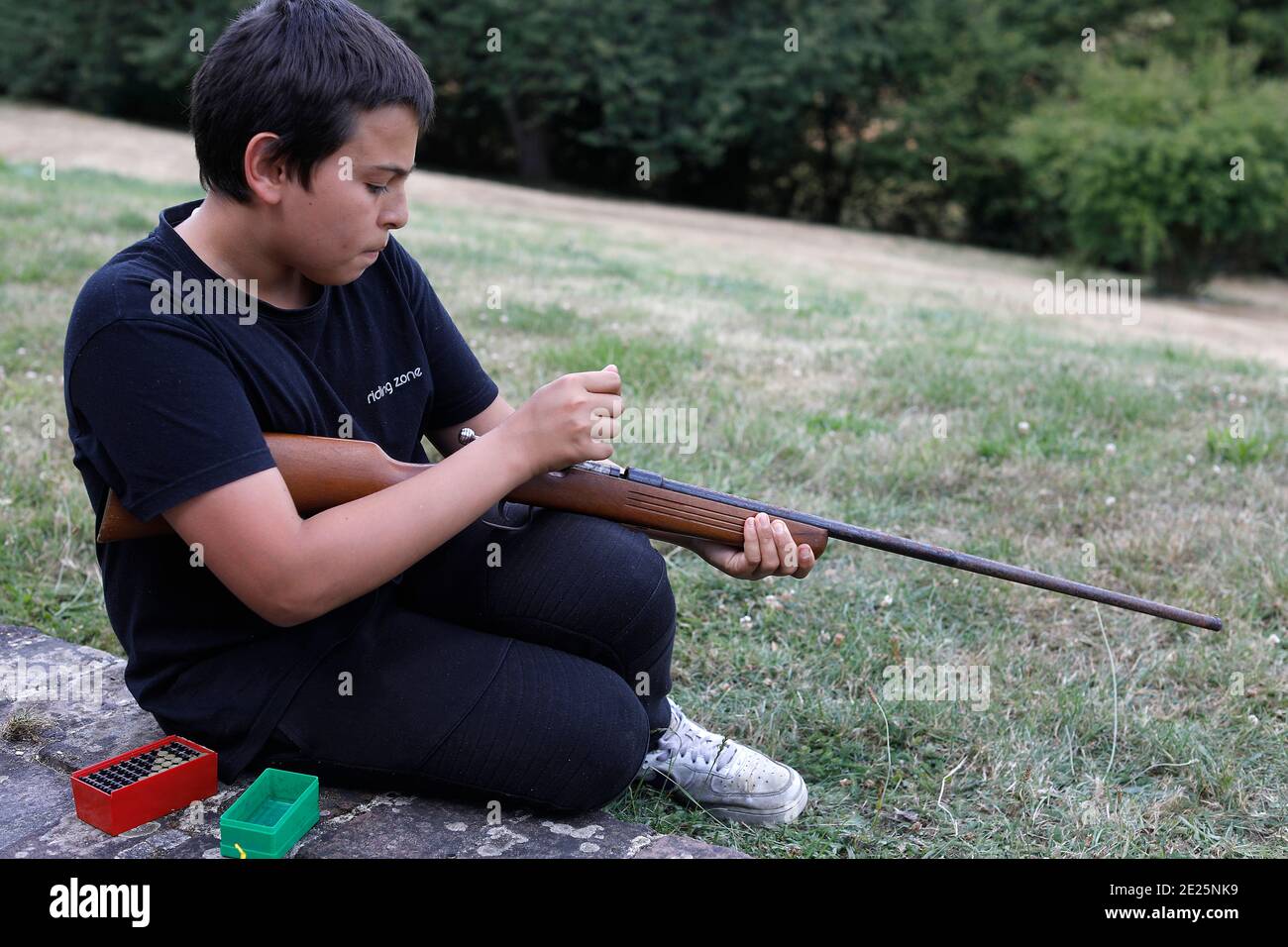 Teenager with a gun. Eure, France. Stock Photo