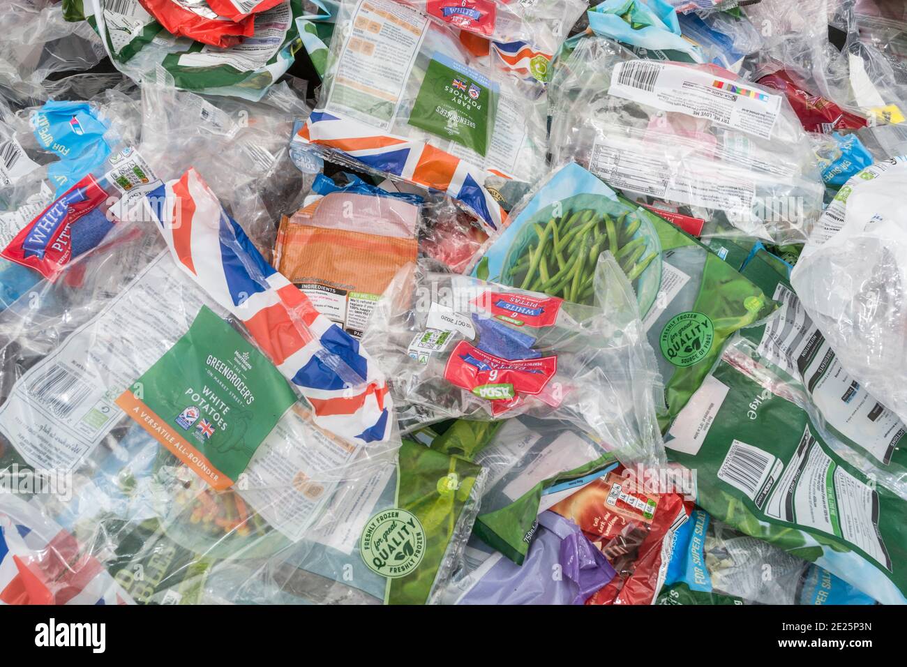 Massed pile of soft plastic food bags and wrapping material from UK supermarkets. For kitchen waste, household plastic waste, single use plastics. Stock Photo