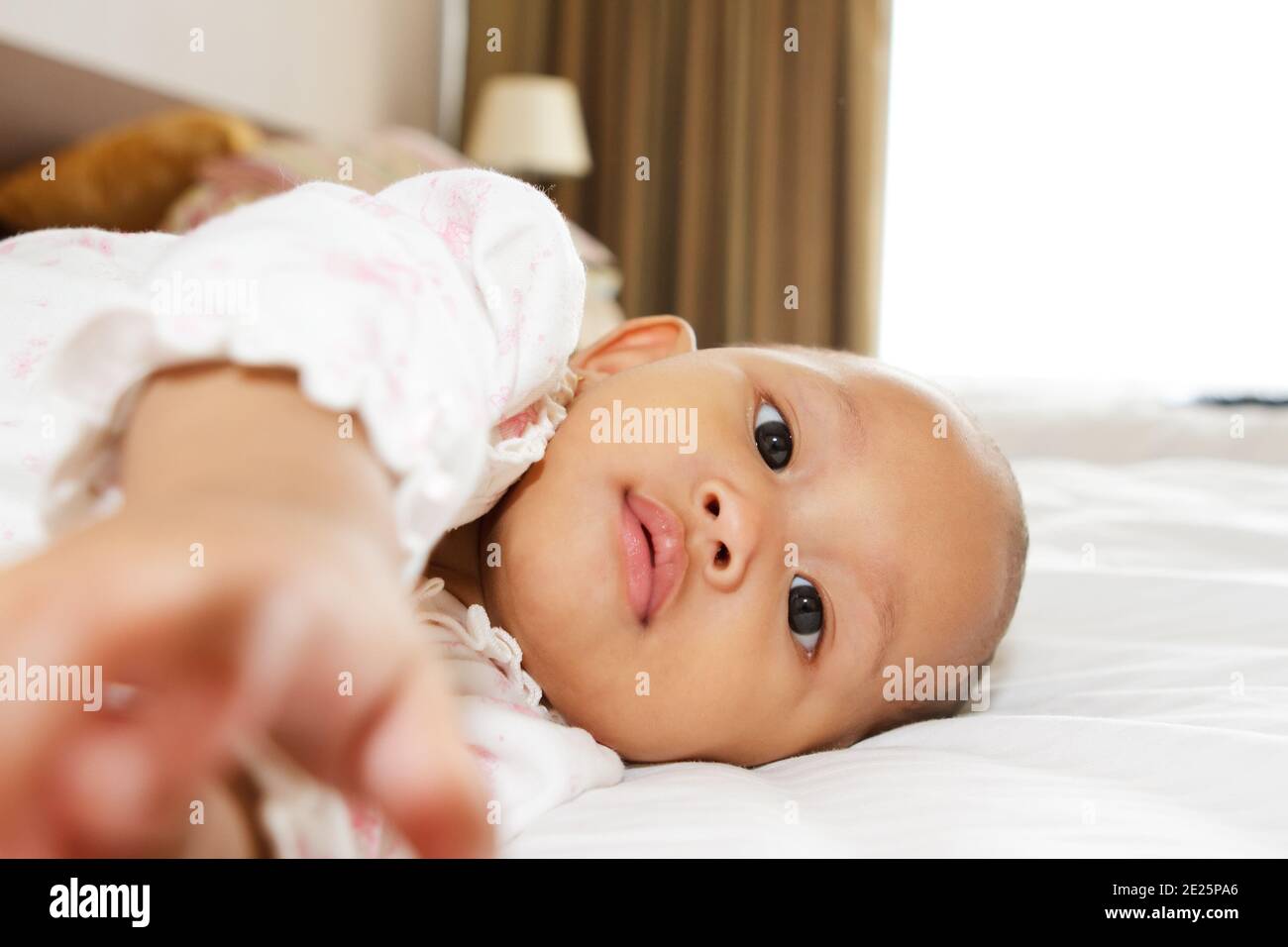 cute asian ethnic baby girl lay on bed Stock Photo Alamy
