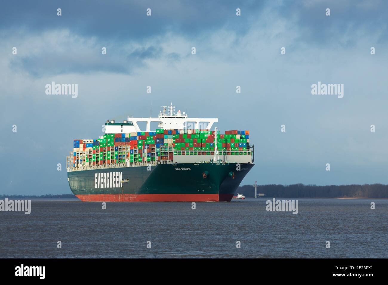 Stade, Germany - January 12, 2021: Container ship EVER GOVERN on Elbe river heading to Hamburg. The vessel is operated by EVERGREEN Marine and sails u Stock Photo