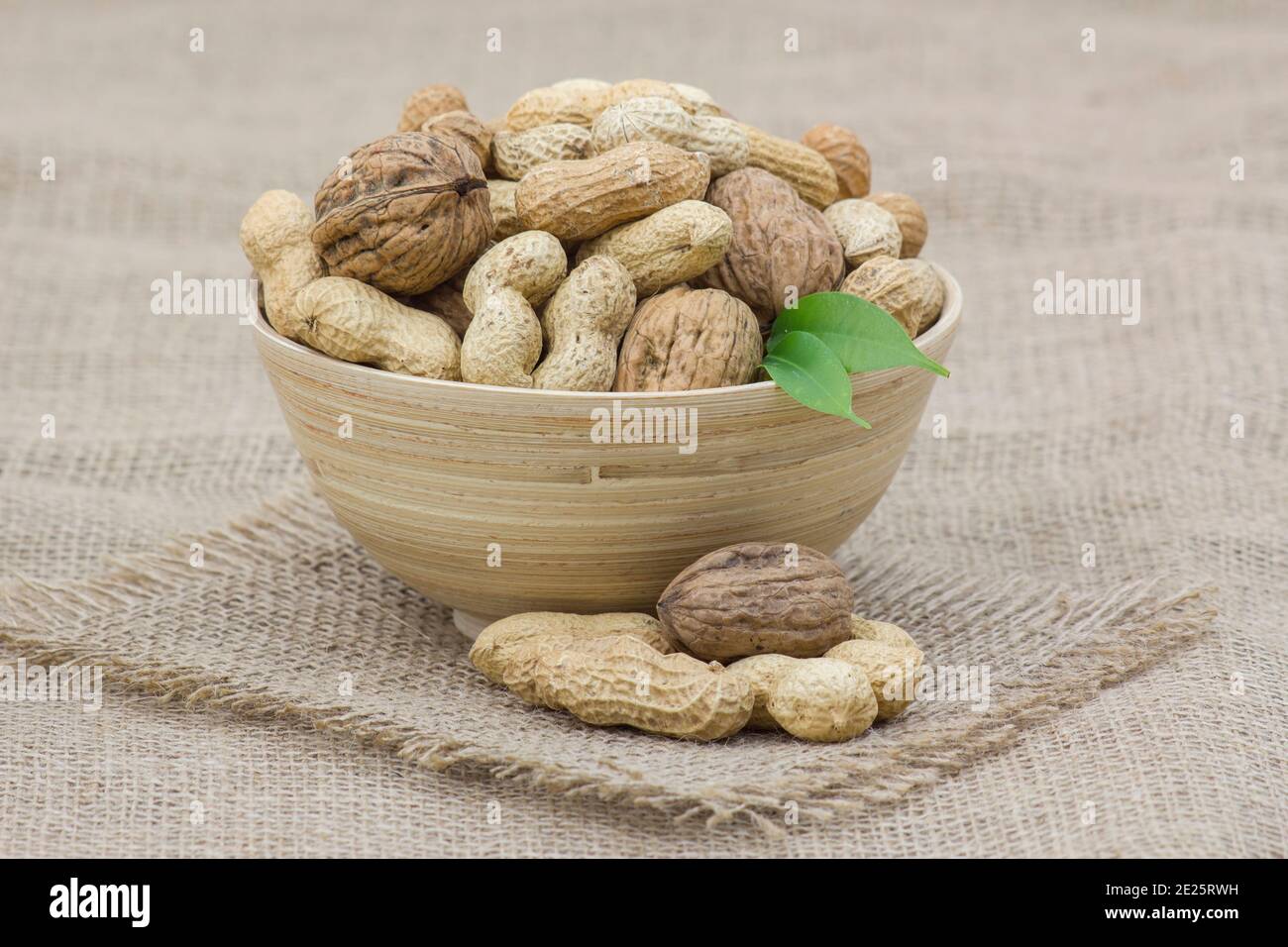 walnuts and peanuts in a bowl Stock Photo