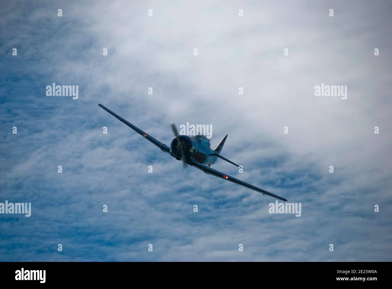 North American T-6 , World War 2 trainer. This image can be used as a background with subtitles on the clouds Stock Photo